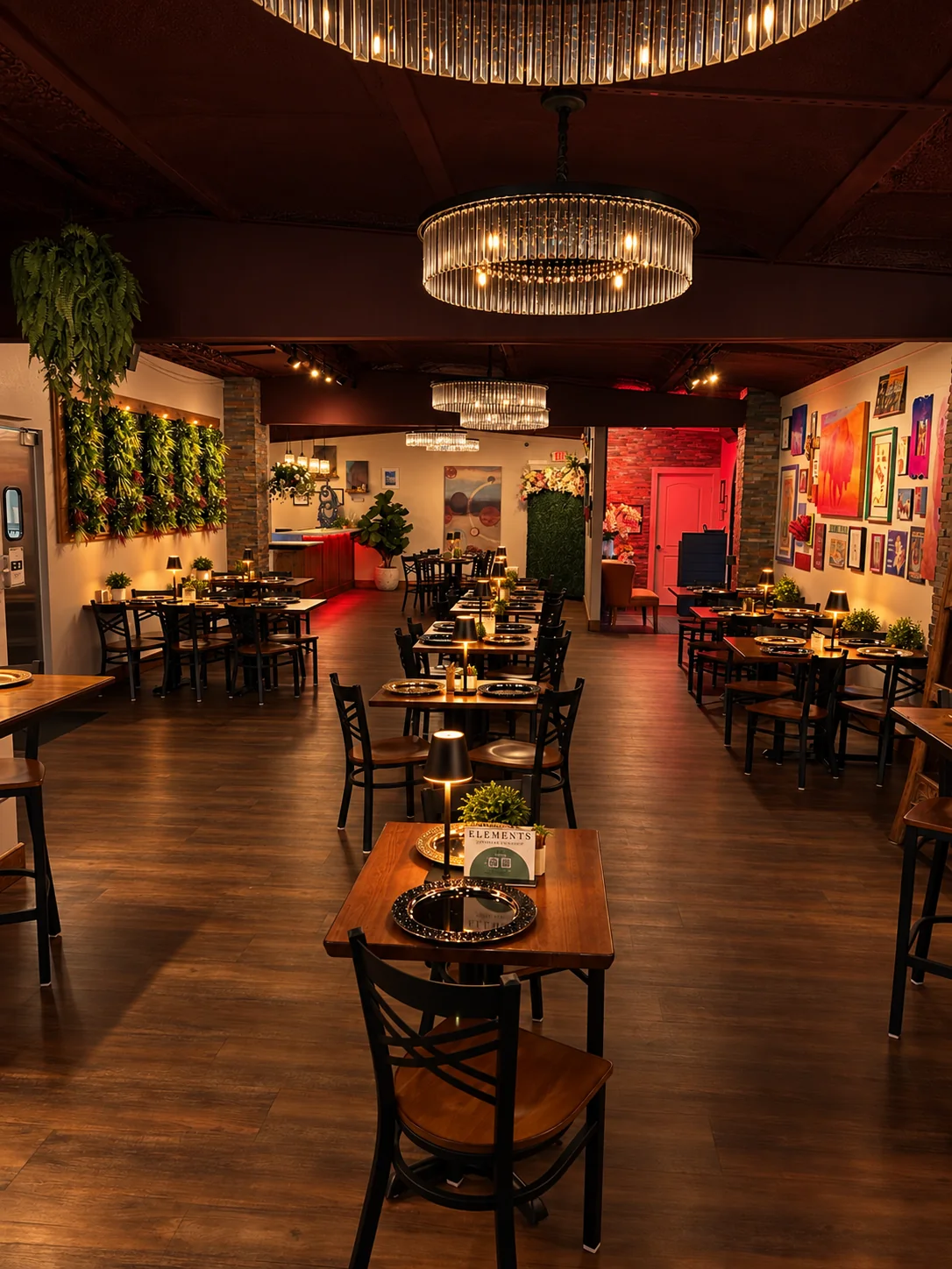 Dining room at Elements by 456 with tables, artwork, and chandelier lighting